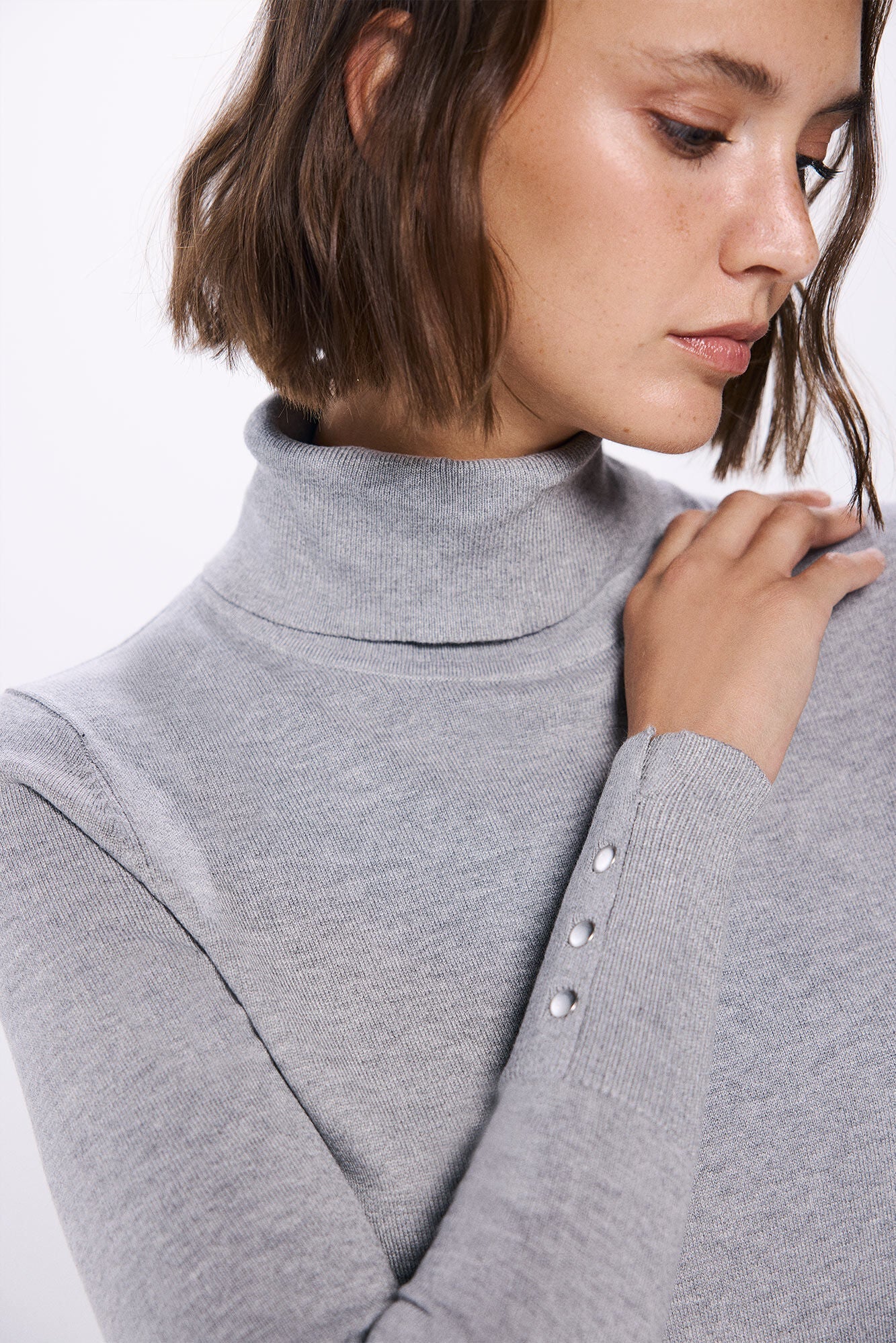 high neck sweater with buttons at cuffs